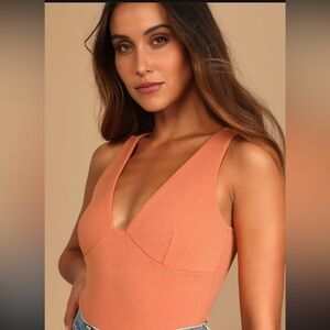 Light orange ribbed sleeveless bodysuit